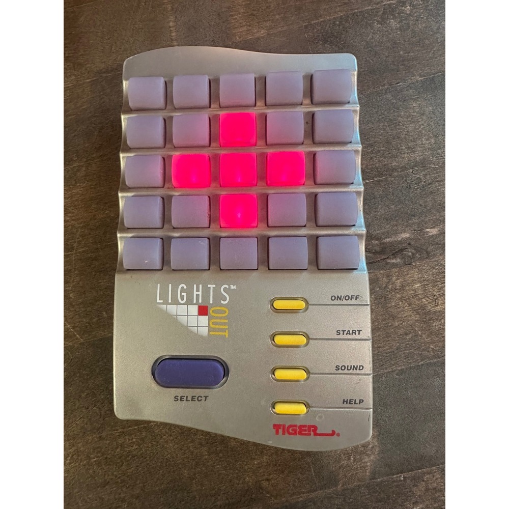 Tiger Electronics Lights Out Handheld game. working